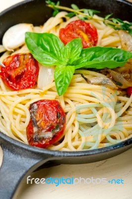 Spaghetti Pasta With Baked Cherry Tomatoes And Basil Stock Photo