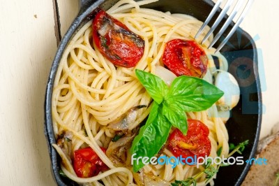 Spaghetti Pasta With Baked Cherry Tomatoes And Basil Stock Photo