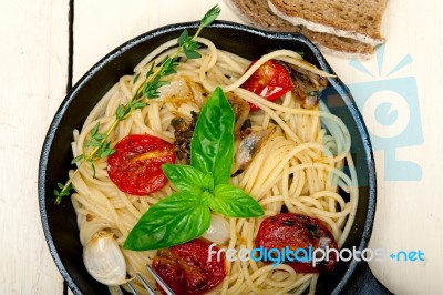 Spaghetti Pasta With Baked Cherry Tomatoes And Basil Stock Photo