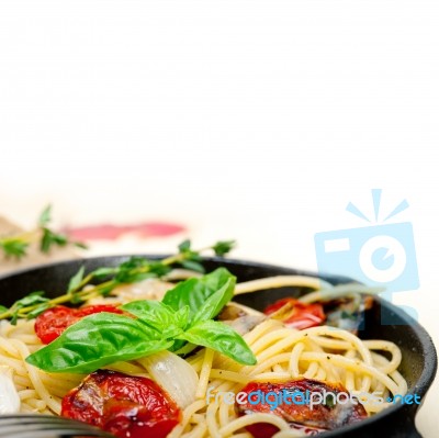 Spaghetti Pasta With Baked Cherry Tomatoes And Basil Stock Photo