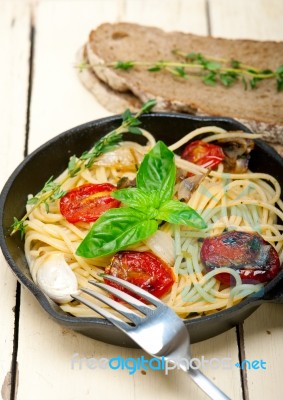 Spaghetti Pasta With Baked Cherry Tomatoes And Basil Stock Photo