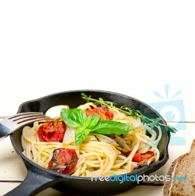 Spaghetti Pasta With Baked Cherry Tomatoes And Basil Stock Photo