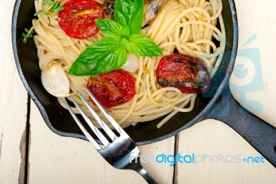 Spaghetti Pasta With Baked Cherry Tomatoes And Basil Stock Photo