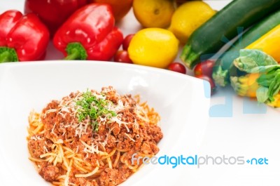 Spaghetti With Bolognese Sauce And Fresh Vegetables On Backgroun… Stock Photo