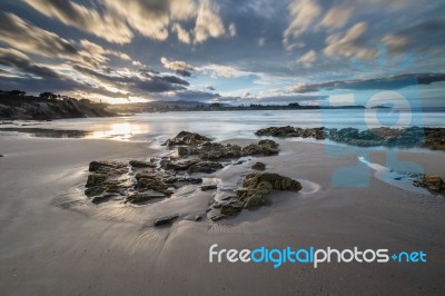 Spectacular Sunset On The Beach Of Arnao, Asturias, Spain, Stock Photo