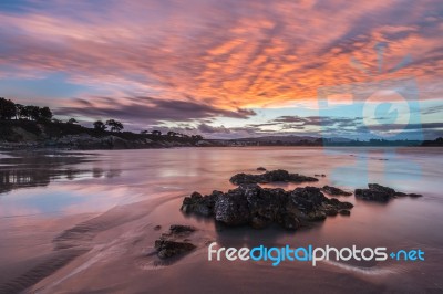 Spectacular Sunset On The Beach Of Arnao, Asturias, Spain, Stock Photo