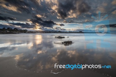 Spectacular Sunset On The Beach Of Arnao, Asturias, Spain, Stock Photo