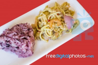 Spicy Green Mango Salad With Berry Sticky Rice Stock Photo