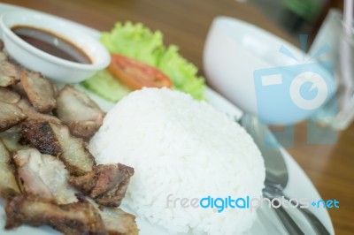 Spicy Grilled Pork With Rice Dish Stock Photo