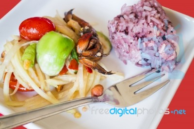 Spicy Papaya Salad (som Tum) With Berry Sticky Rice Stock Photo