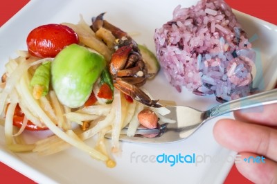 Spicy Papaya Salad (som Tum) With Berry Sticky Rice Stock Photo