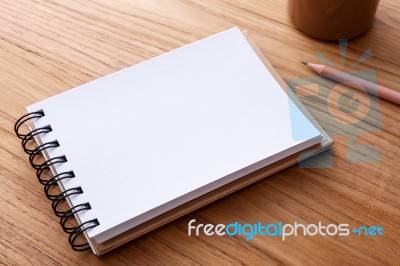 Spiral Notebook On Wood Table Stock Photo