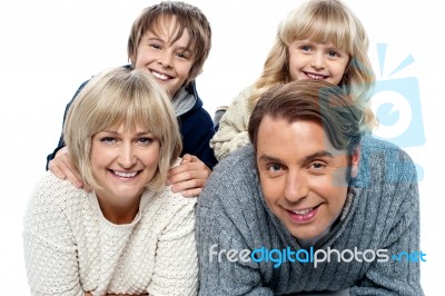 Spirited Kids Having Fun With Their Parents Indoors Stock Photo