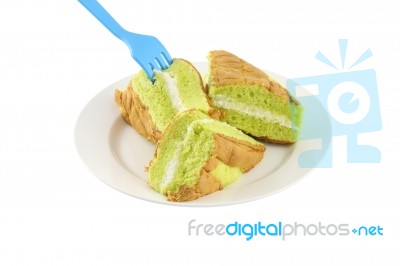 Sponge Cream Cake Dish And Blue Fork On White Background Stock Photo