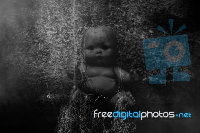 Spooky Doll In Haunted House Stock Photo