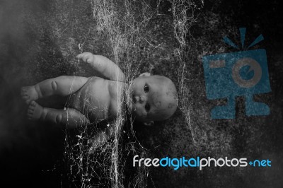 Spooky Doll In Haunted House Stock Photo