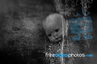 Spooky Doll In Haunted House Stock Photo