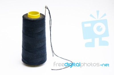 Spool Of Thread With Needle Stock Photo