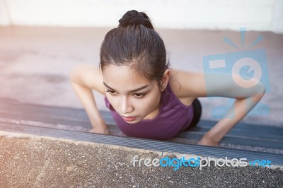 Sport Urban Young Athletic Woman Doing Push-ups. Muscular And St… Stock Photo