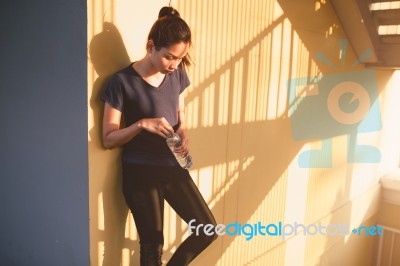 Sports Women Relax Time And Drinking Water Stock Photo