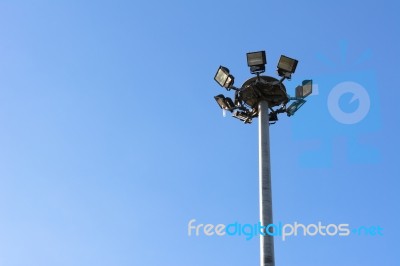 Spotlights Electric Poles With Blue Sky  For Background Stock Photo