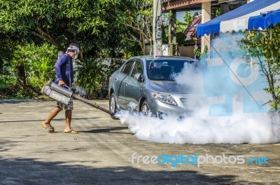 Spraying Mosquito Repellent Stock Photo