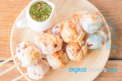 Squid Grilled Ball On Wooden Plate Stock Photo