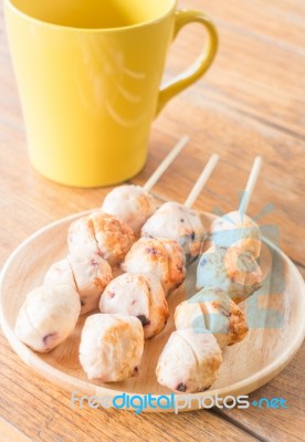 Squid Grilled Ball On Wooden Plate Stock Photo