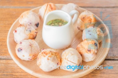 Squid Grilled Ball On Wooden Plate Stock Photo