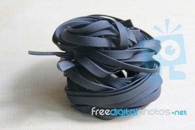 Squid Ink Black Pasta On Wood Background Stock Photo