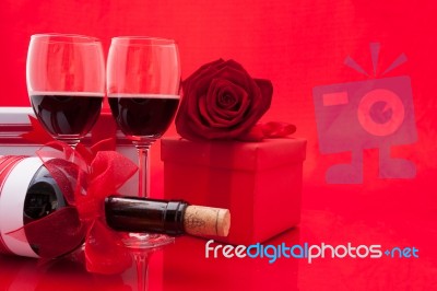 St Valentine's Setting With Present And Red Wine Stock Photo