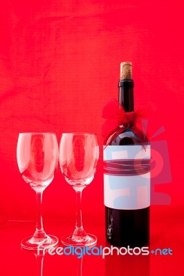 St Valentine's Setting With Present And Red Wine Stock Photo