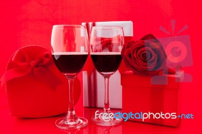 St Valentine's Setting With Present And Red Wine Stock Photo