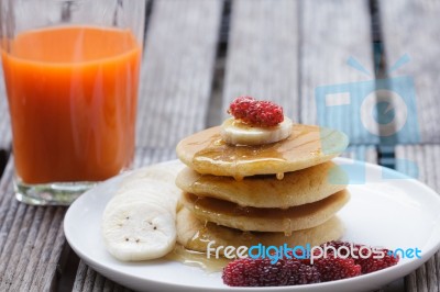 Stack Of Delicious Pancakes With Fresh Fruits Stock Photo