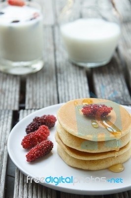 Stack Of Delicious Pancakes With Fresh Fruits Stock Photo