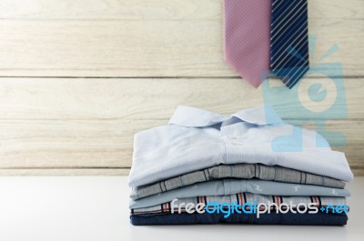 Stack Of Men Shirts With Tie Stock Photo