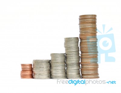 Stacked Coin On An Isolated White Background Stock Photo