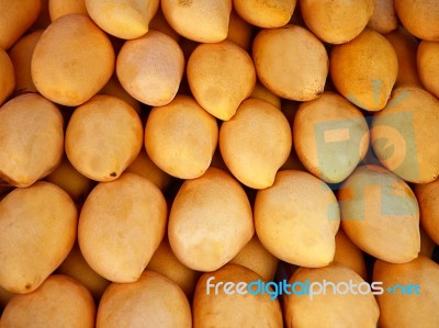 Stacking Yellow Mangoes Stock Photo