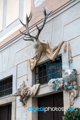 Stag And Boar Statues Over A Door In Krumlov Stock Photo