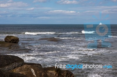 Staithes, North Yorkshire/uk - August 21 : Yacht On The Horizon Stock Photo