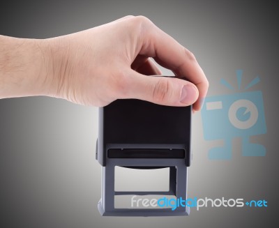 Stamp In Businessman Hand On Grey Background Stock Photo