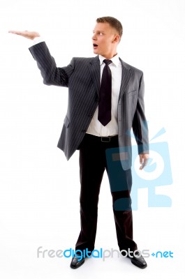 Standing Adult Man With Open Palm Stock Photo