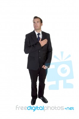 Standing Businessman Saluting By Heart Stock Photo