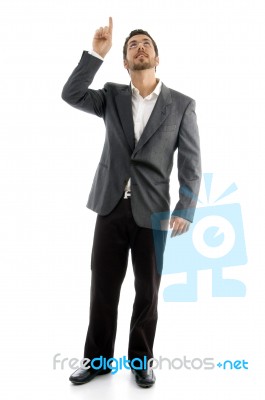 Standing Man Pointing Upward Stock Photo