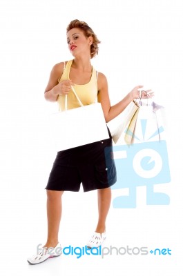 Standing Model Holding Shopping Bags Stock Photo