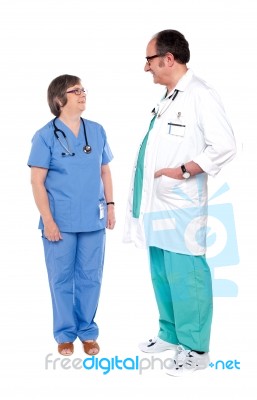 Standing Senior Surgeons On White Stock Photo