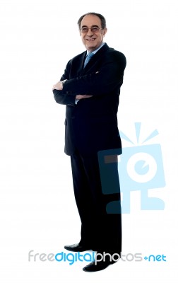 standing Smiling Senior Executive Stock Photo