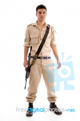 Standing Soldier With Gun Stock Photo