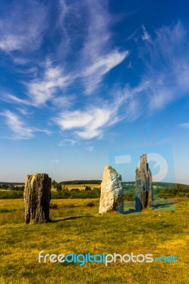 Standing Stones In A Green Field Stock Photo