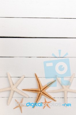 Starfish On White Wood Stock Photo